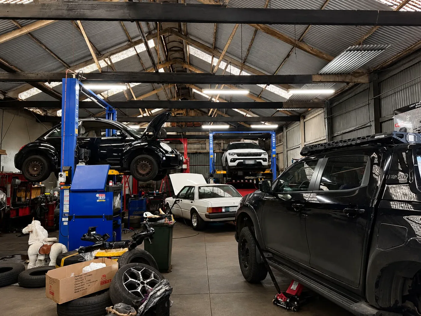 The Light Wheel Alignment workshop floor in Adelaide with cars raised on hoists