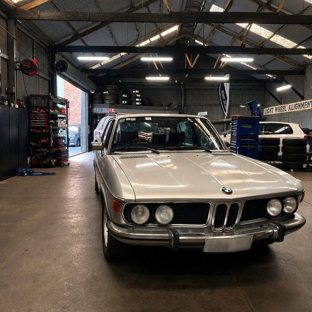 A classic BMW coupe in the workshop waiting for service